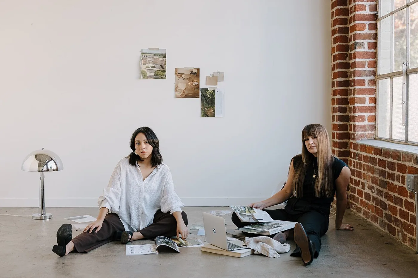 Courtney and Alexa collaborating on the studio floor