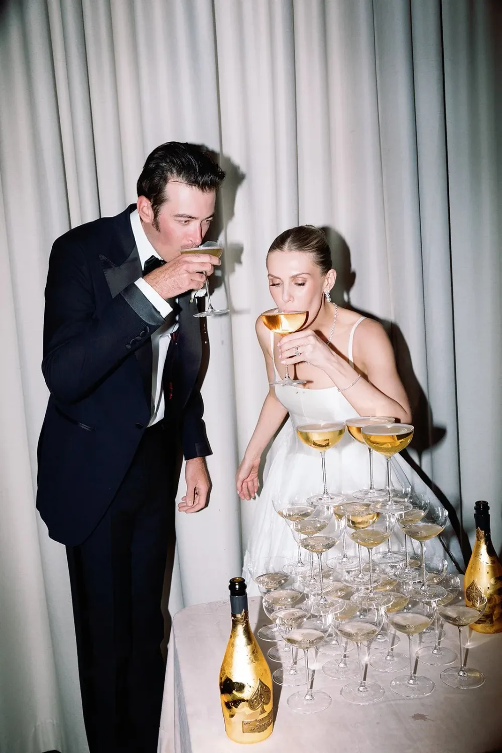 Corinne and Matt celebrating with espresso martinis